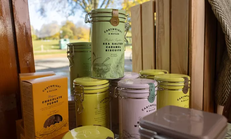 Selection of coloured tins of Cartwright and Butler sweet treats 