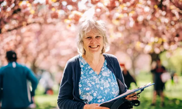 Smiling woman in the park in springtime