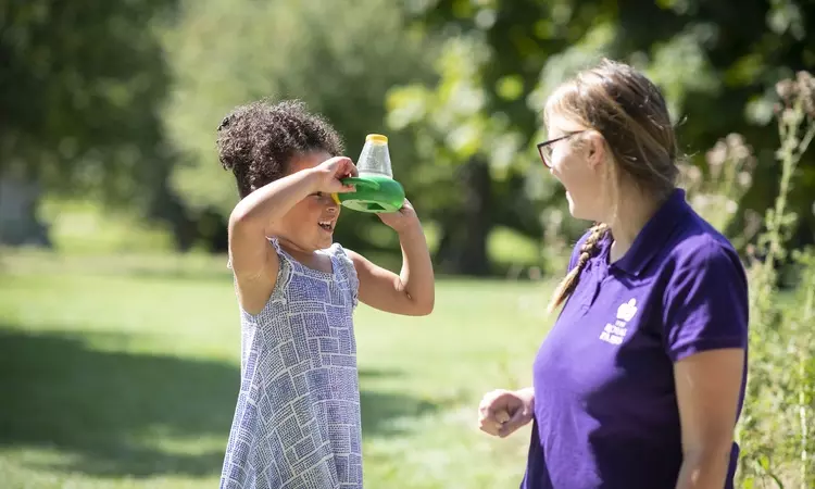 A young girl learning about nature